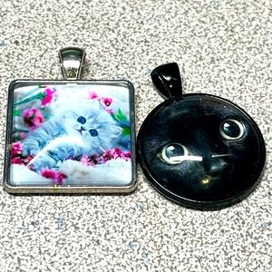 Two cat pendants -new never worn-no chains
